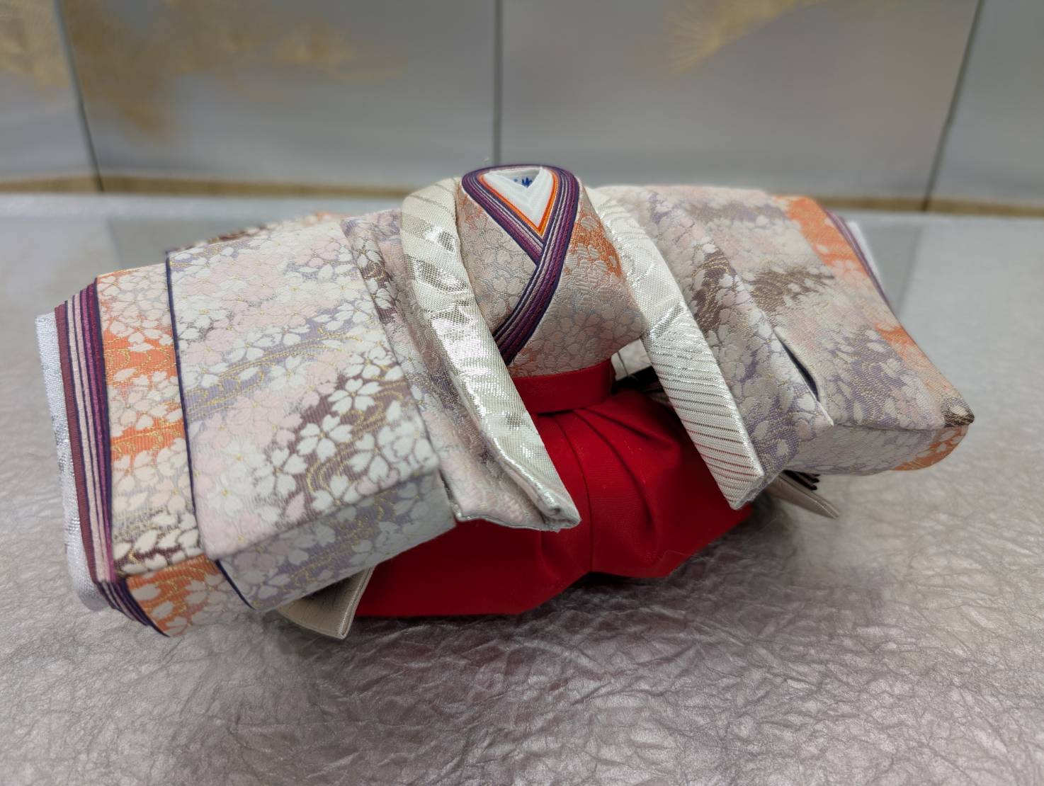 Dressing in progress: the layered collars of the hina doll costume taking shape